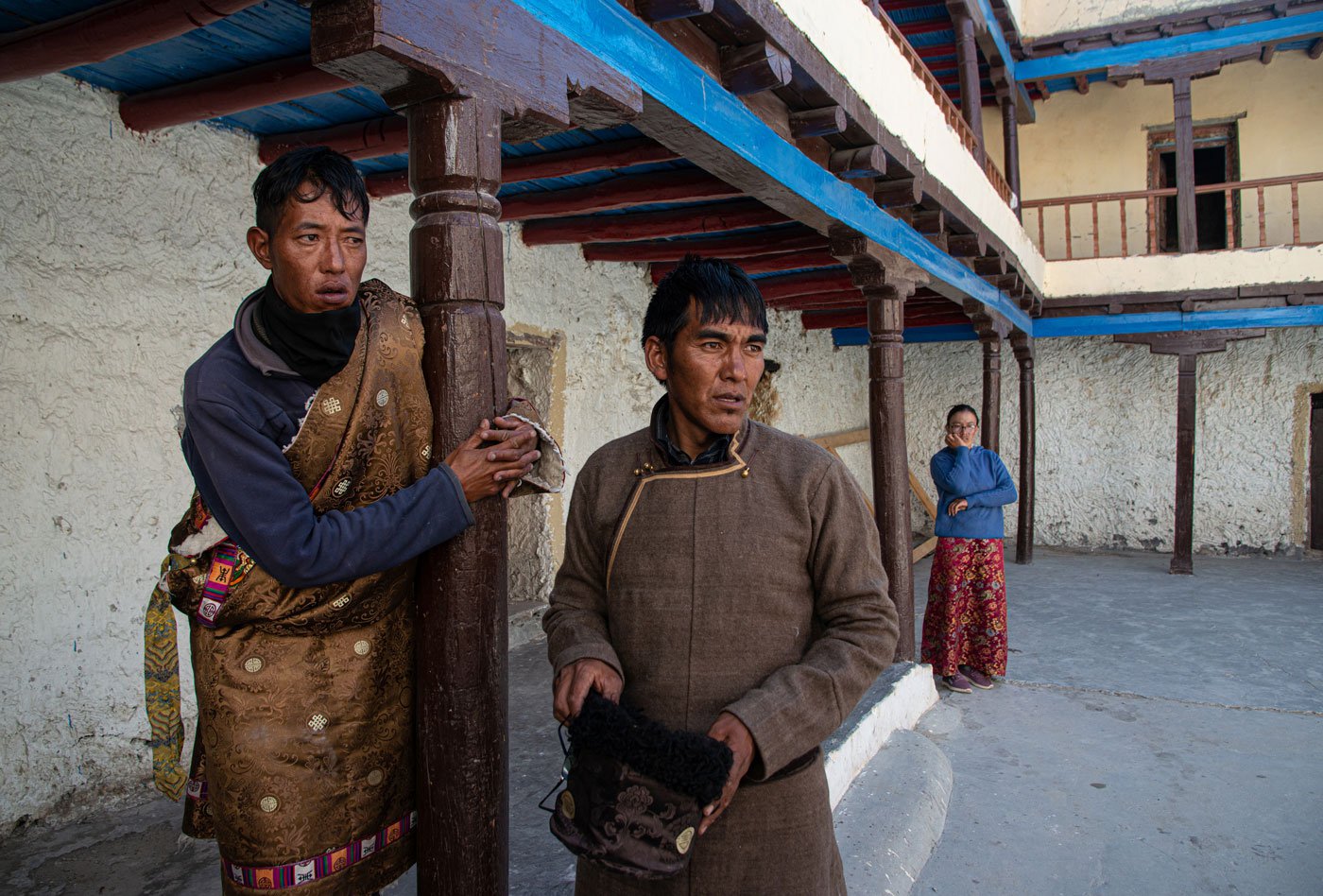 Inside the monastery, villagers Rangol (left) and Kesang Angel (right) observe the prayers and ceremony