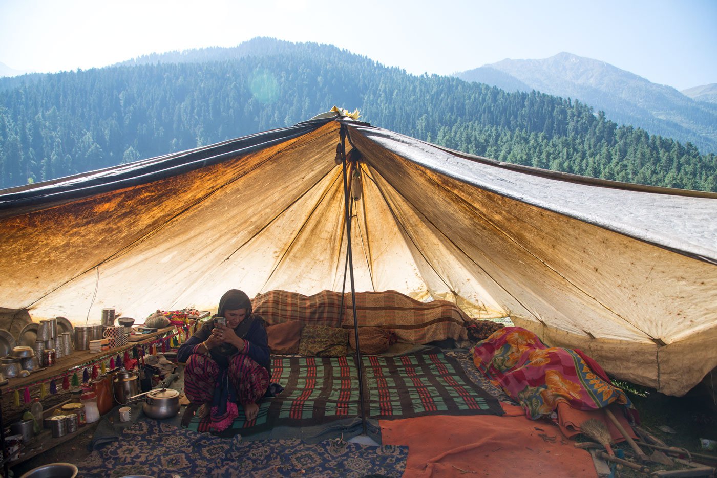 Meena Akhtar recently gave birth. Her newborn stays in this tent made of patched-up tarpaulin and in need of repair
