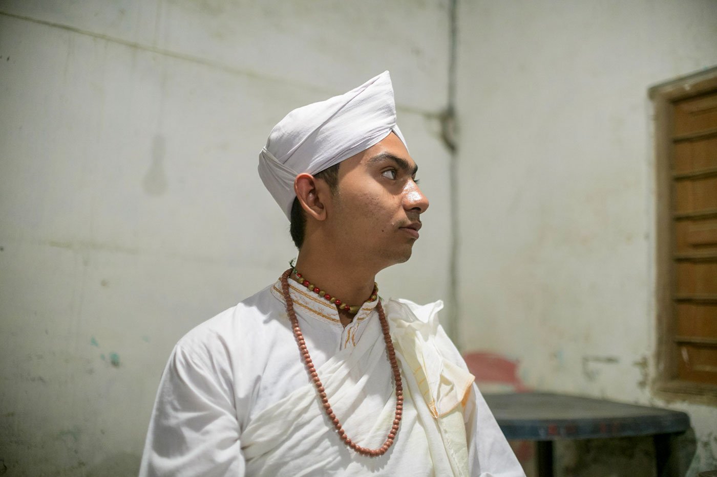 Shantanu Bhuyan poses for a portrait on the first evening of the Raas Mahotsav, one of the major festivals in Majuli