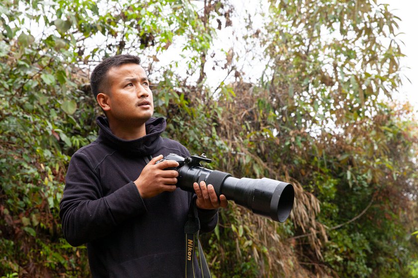 Micah with his camera in the jungle (left) and in the research hut (right)