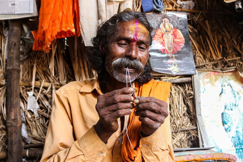 Right: He carefully ties the reed to the mandrel using a cotton thread