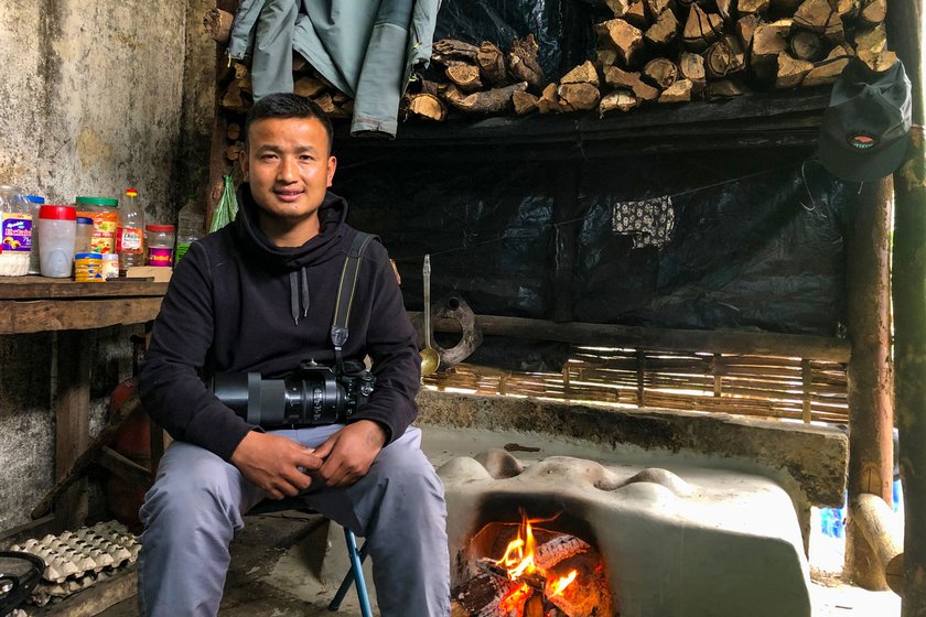 Micah with his camera in the jungle (left) and in the research hut (right)