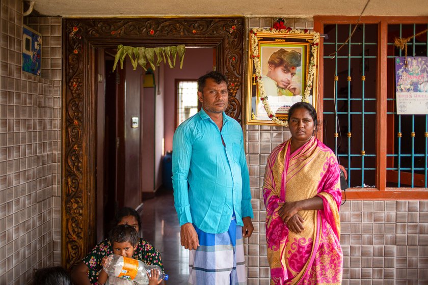 Right: Illumparidhi's parents, Bhanu and Senthilkumar stand near their son's photo