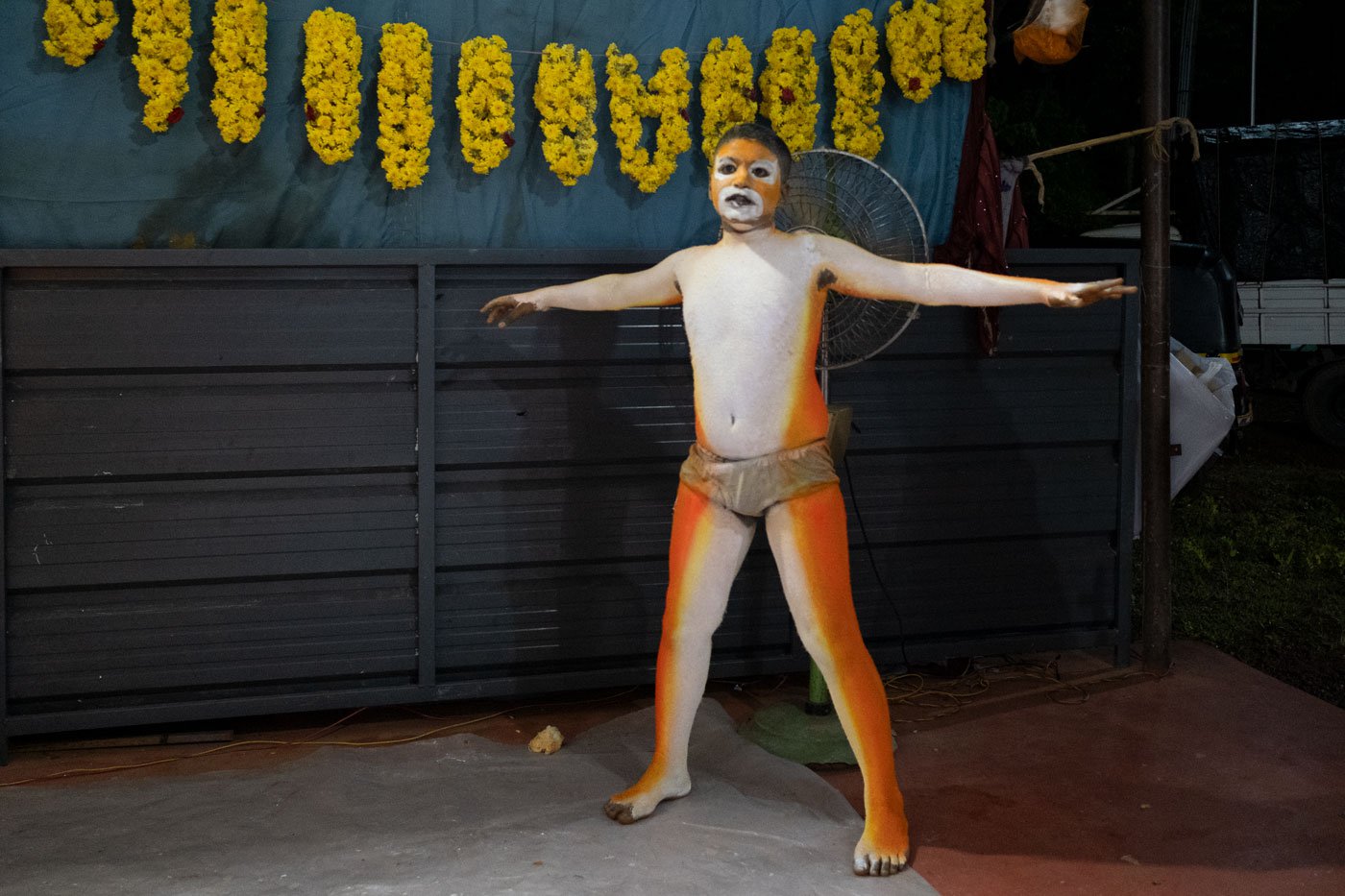 Bhuvan Amin drying paint under the fan. 'This is my eighth time performing pili vesha ,' says the 11-year-old who has been participating in the dance since he was three