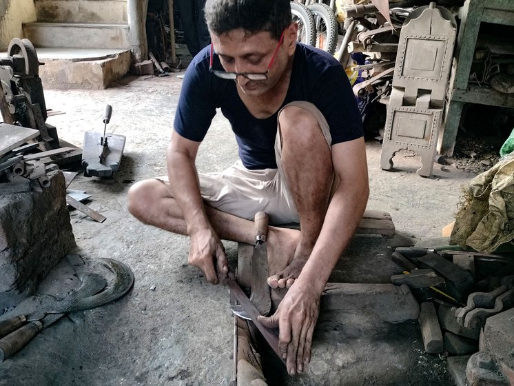 Rajesh sharpens (left) and then files (right) the newly crafted tools before they are handed over to the customer