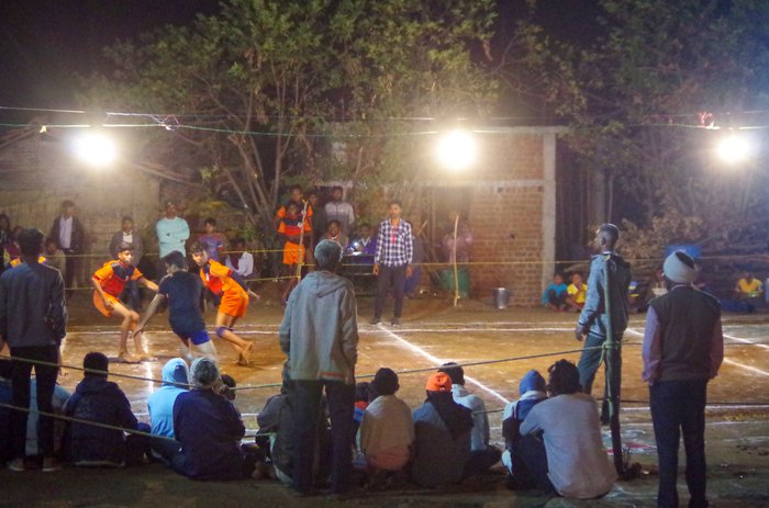 Villages play a game of kabaddi during a night-tournament
