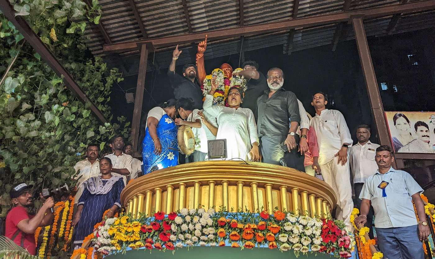 Towards the end of the rally, some of the participants go to the top of the Ambedkar statue and put a garland as a mark of respect