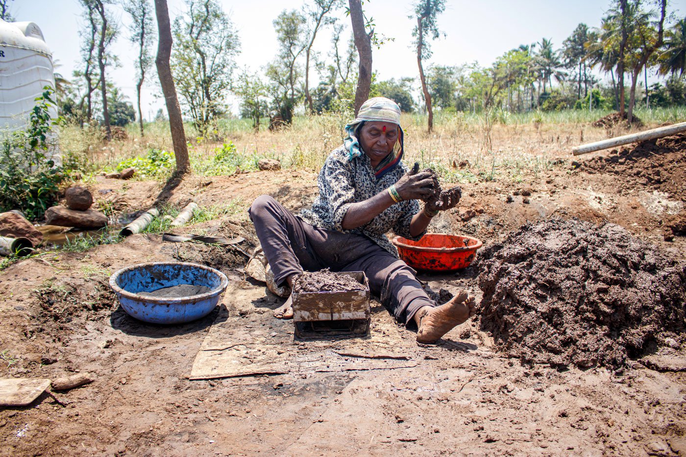 Left: Sushila, Narayan's wife, works at a brick kiln and also helps Narayan in making pinwheels, shehnais and flutes.