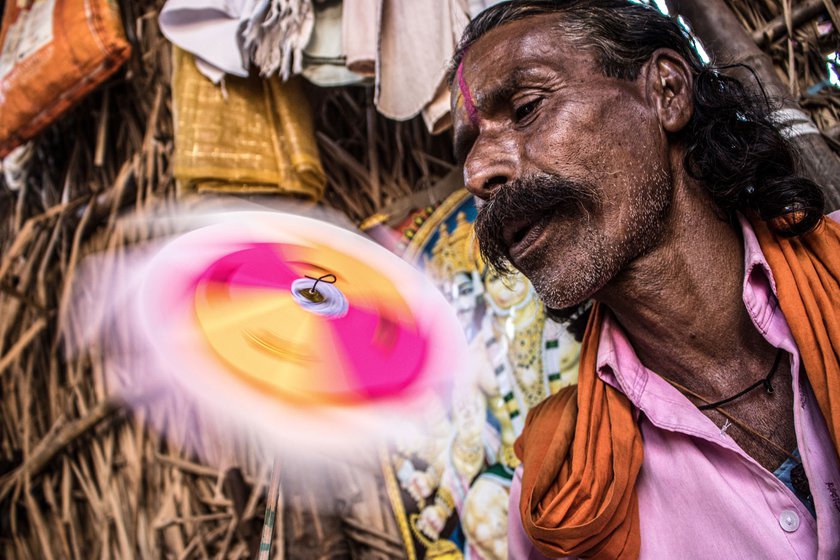 Right: Narayan started making colourful pinwheels three decades ago to supplement his income
