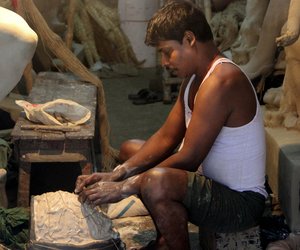 Artisan preparing the clay