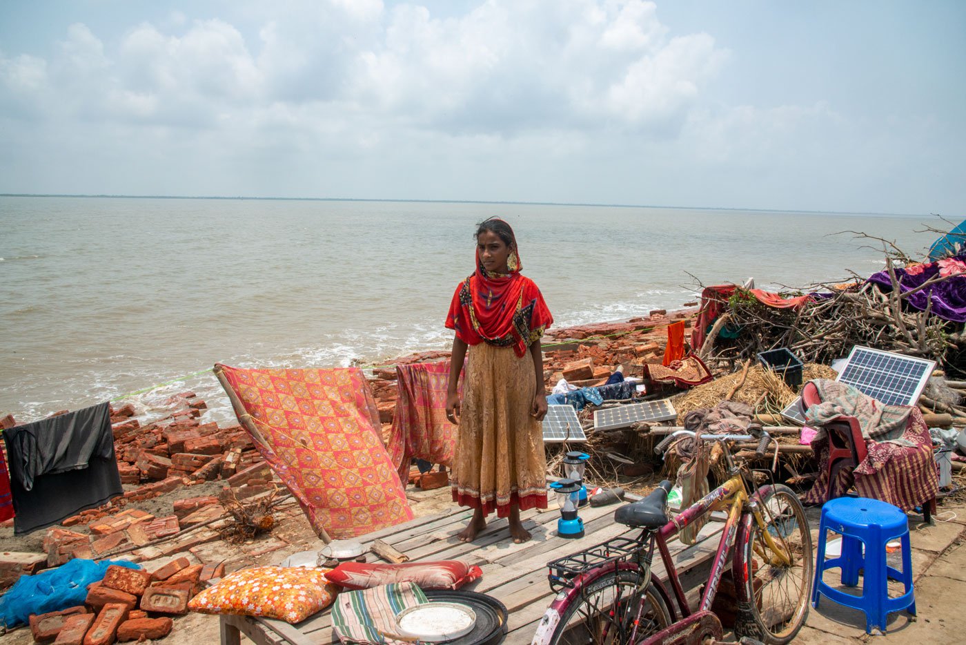 Ruksana, who also lives near the embankment, lost her school textbooks in the flood