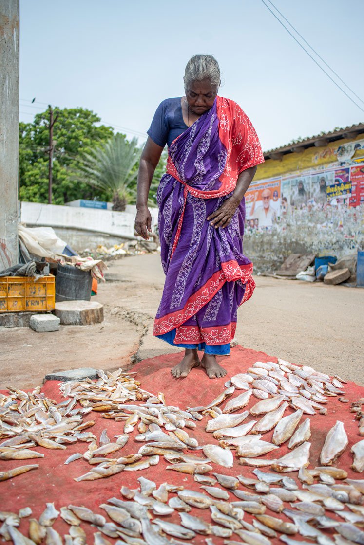 Left: Frederique with the fish she's drying near her house.