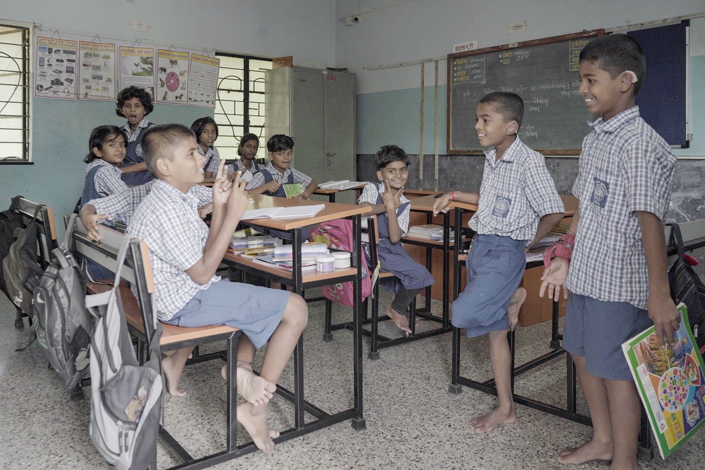 Children at the Dhayari School for the Hearing Impaired chat with each other. ‘Sometimes, children come up with their own sign,’ says Satyabhama Alhat, a special teacher working with the school