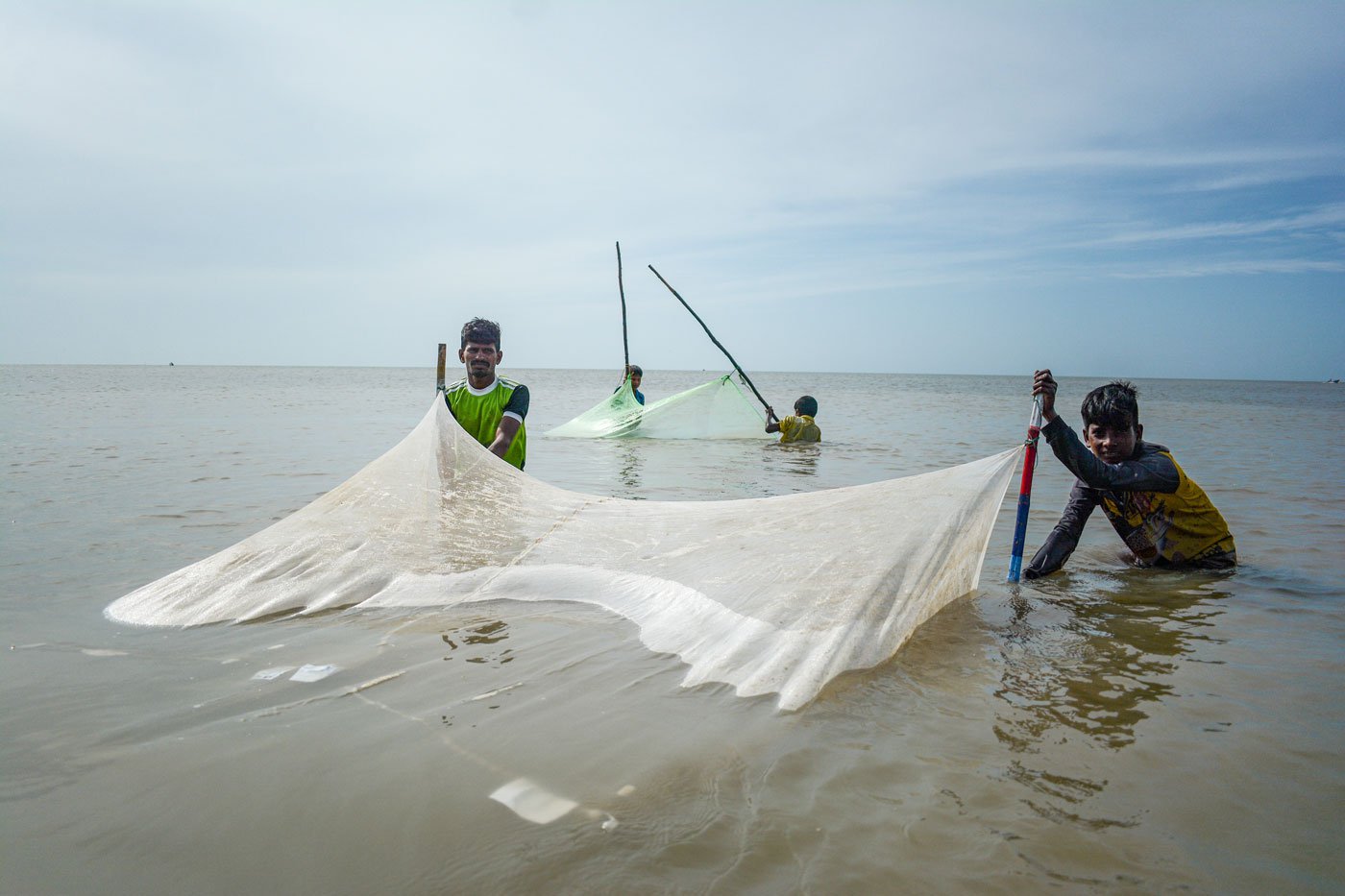 In Velappam, Nagapattinam, Sakthivel and Vijay pull the nets that were placed to trap prawns.
