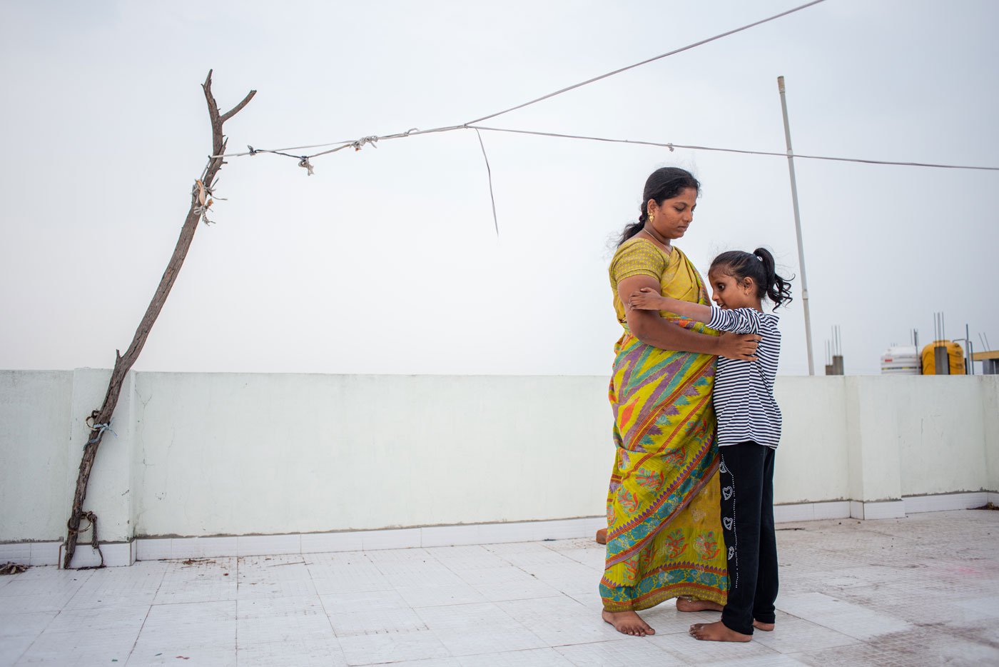 Lebana pleading with her mother to carry her on the terrace of their house in Gummidipoondi