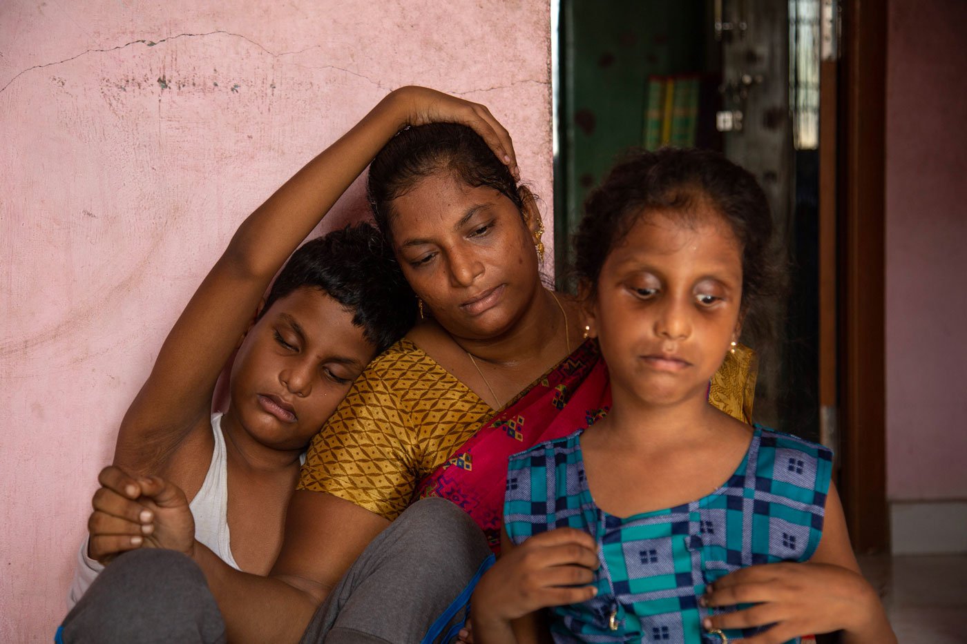 Despite the daily challenges of caring for her three children, Saranya finds peace in spending time with them at home