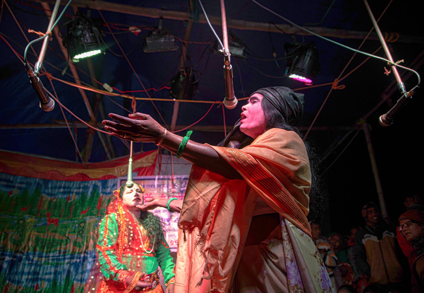 Actors perform a scene from the Bonbibi pala gaan . Golabibi (in green) is compelled to choose between her two children, Bonbibi and Shah Jangali. She decides to abandon Bonbibi