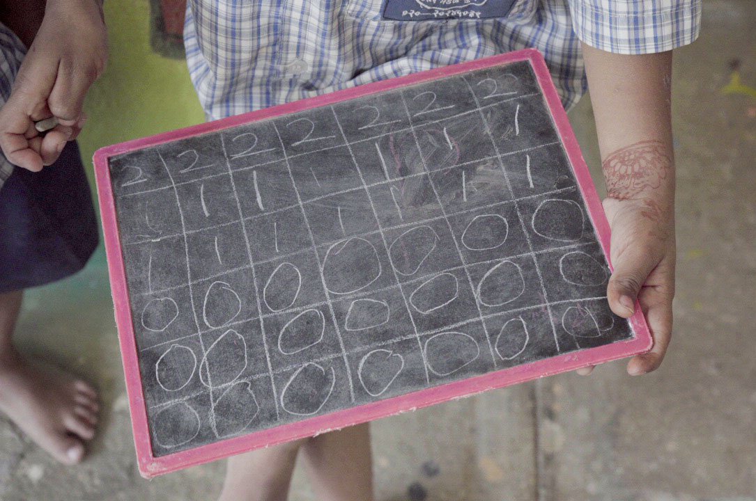 A child learning to write numbers