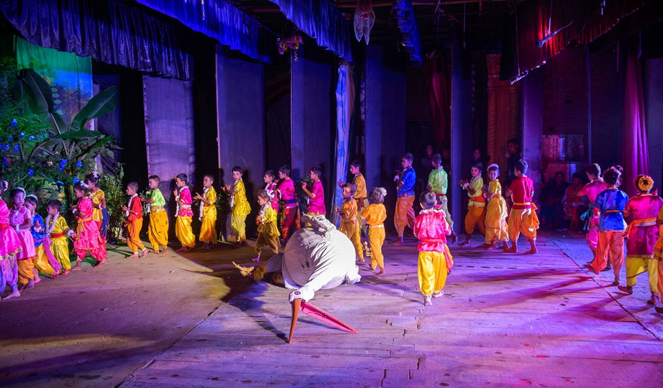 At the Garamur Saru Satra, children acting out the scene where a young Krishna defeats and kills the demon Bokasur, who takes the form of a crane