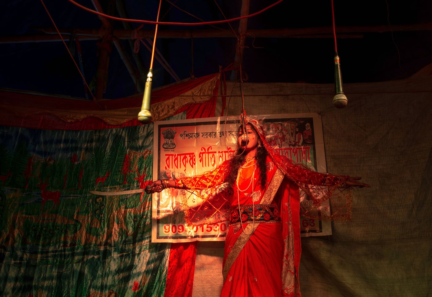 Usharani delivers her lines as Narayani, the mother of Dakkhin Rai. In the pala gaan , she also plays the roles of Bonbibi and Fulbibi
