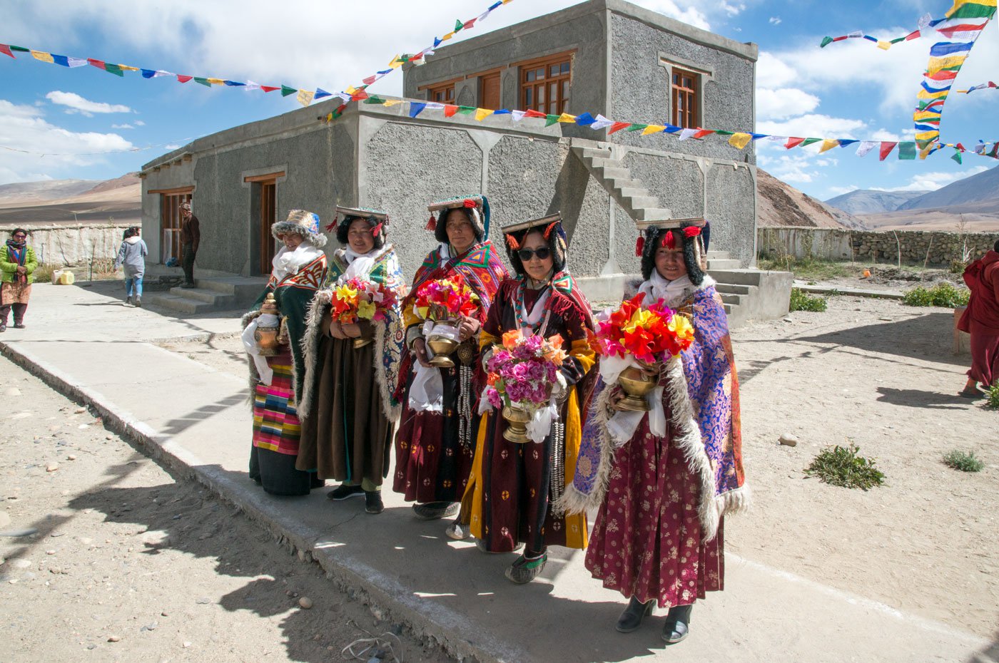 Inside the Punguk Gompa, the women dressed in their traditional attire, wait for the arrival of their friends from Khuldo