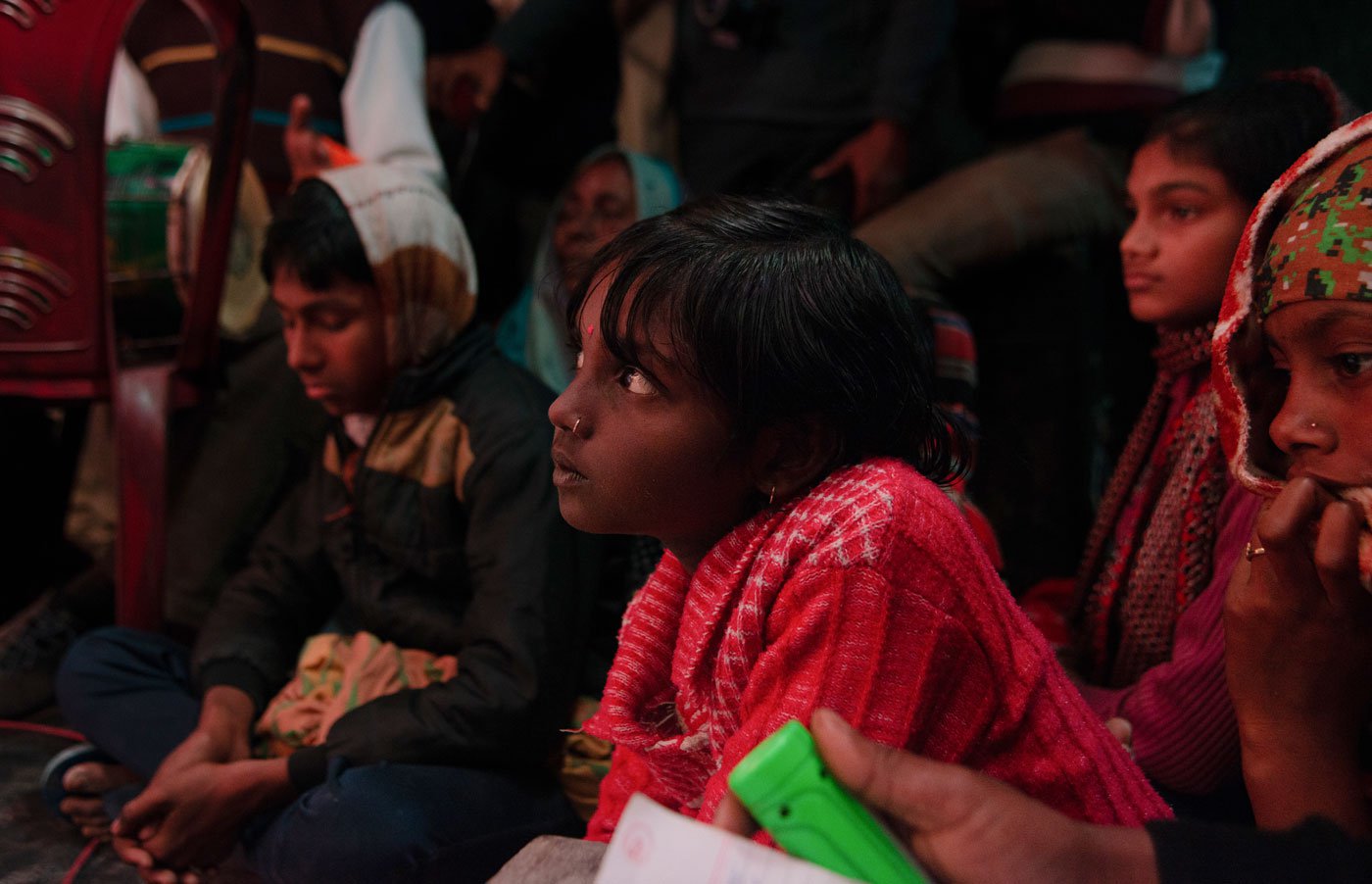 A child from Jawahar Colony village in the audience is completely engrossed in the show