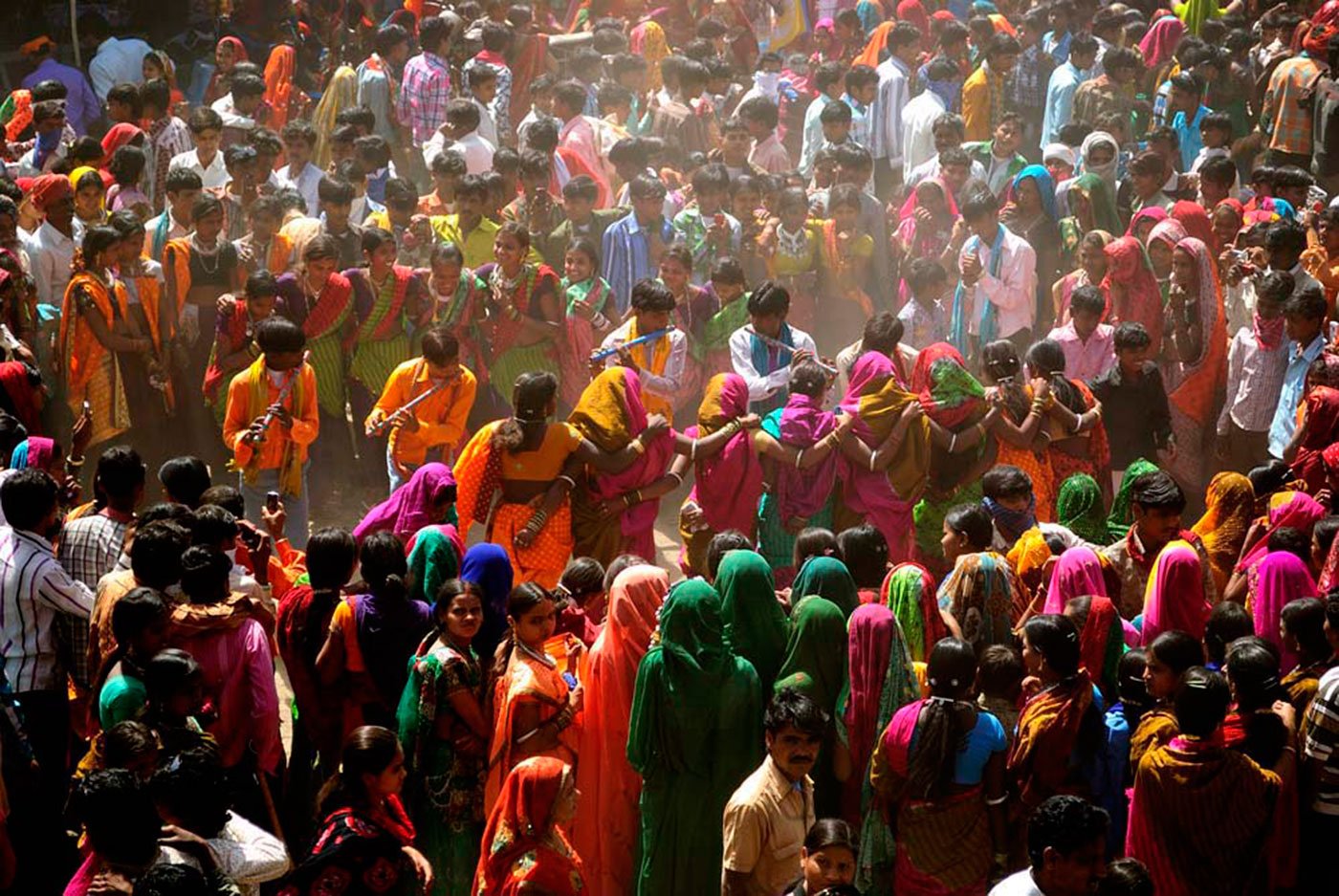 Adivasis in Bakhatgarh village dancing during the colorful Bhagoria festival, which celebrates the kharif harvest just prior to Holi in spring