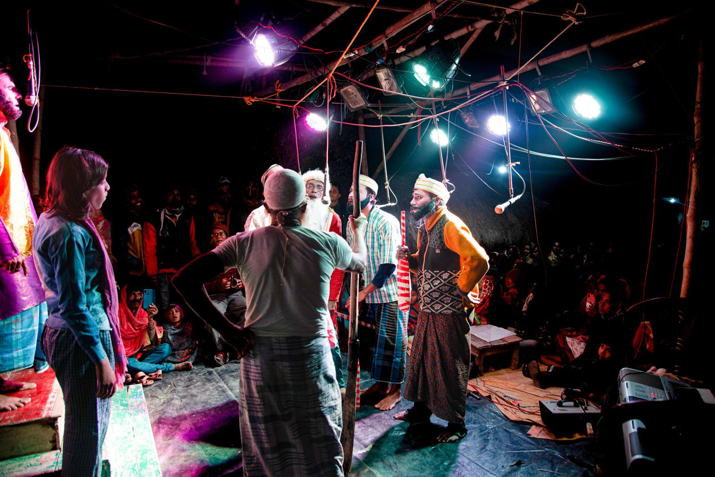 Boatmen and Dhana strategise on how to get honey from the forest