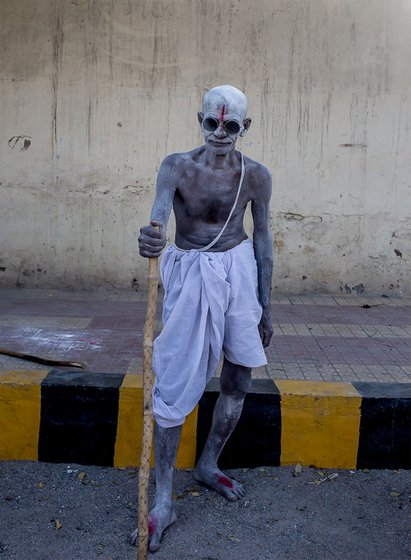 a man refashioned as Mahatma Gandhi