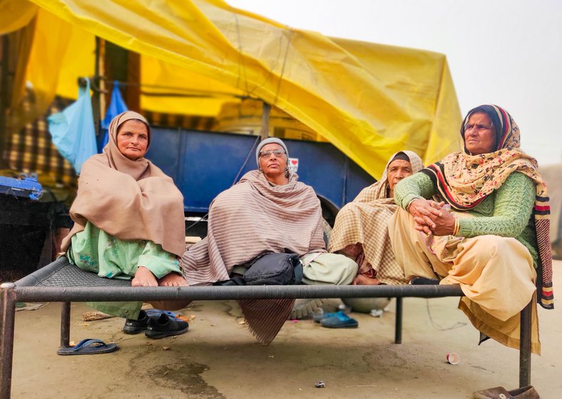 Left: Hardeep Kaur (second from left) says, 'We will go back  for a while when he [an employee looking after their farmland] needs us there. We will be replaced by someone here for that duration'. Right: Entire families at Singhu are engaged in this rotation 