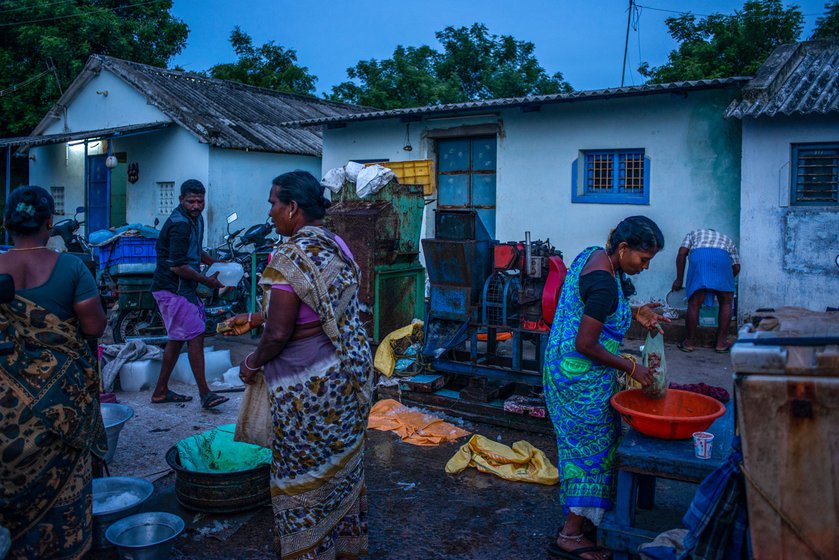 Left: Kavitha (blue sari) sometimes buys fish from the market to cook at home.