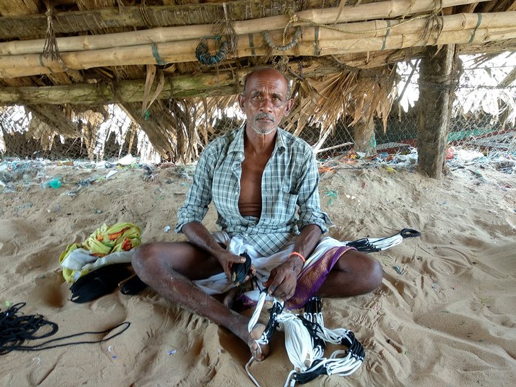 Man working on fish net