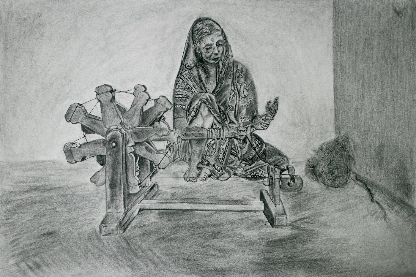 Woman making threads at the charkha