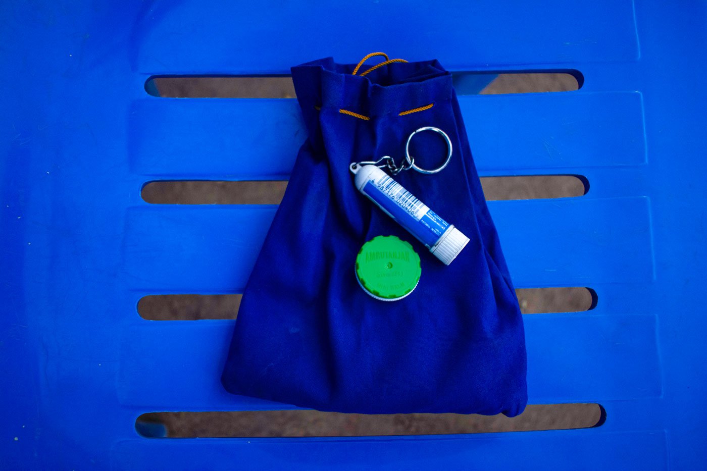 Rani’s drawstring pouch with her Amrutanjan and inhaler.