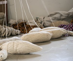 Devu Bhore, of Boragaon village in Chikodi taluka of Belgaum district, stretches cotton yarn from the floor of his home to a hook in the ceiling to make yarn bundles, each weighing 1.5-2 kilos