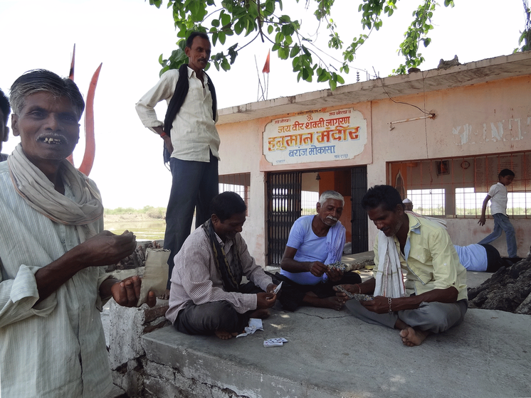 Baranj Mokasa lost over 500 hectares to the coal mine. Many now while away their time in the absence of any work 