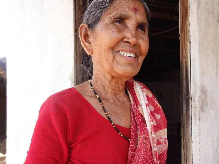 Panchfulabai Velekar standing outside her house