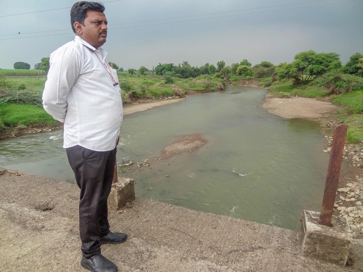Punjab Rajegore, sarpanch of Shelgaon in Nanded, standing on the Uma river bridge that was submerged in the flash floods of July.