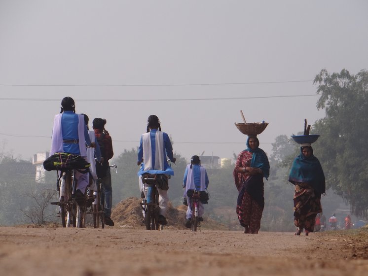 School girls riding their cycles in town