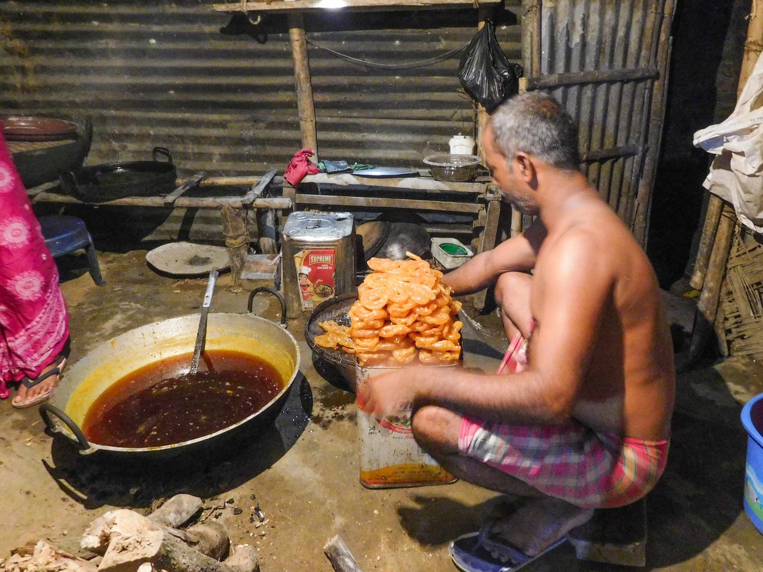 Nosumuddin starts preparing crunchy jalebis before dawn. Recalling his days as a cowherd, he says: ‘I would get tired working all day, and at night if not given enough food or given stale food, how would you feel? I felt helpless’