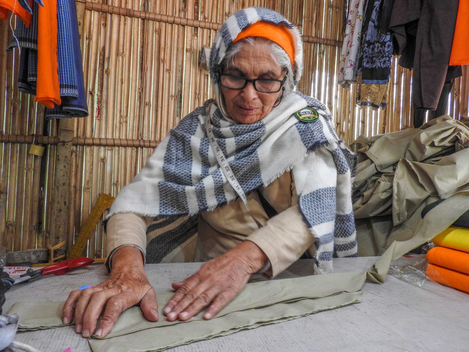 Mohini Kaur came to the Singhu protest site in November 2020 and volunteered to stitch and mend the protesting farmers' clothes. "They grow food for us, this was something I could do for them," she says