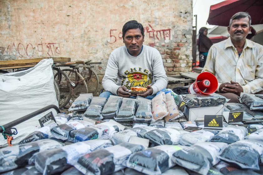 Ramdari Sharma, who works at a petrol pump near the Singhu site, asserts that his support for the protesting farmers is for a better future for the country. Right: Deepak's socks' sales have been hit, but he says, 'Don't think that I won't support the farmers. Their problems are much greater than my own'