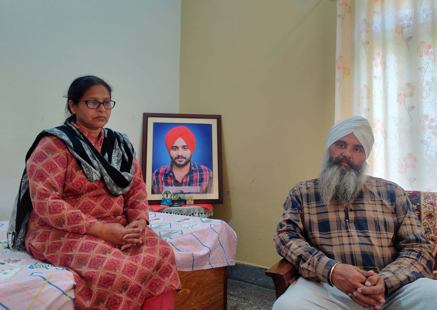 The death of their son, Navreet Singh (in the framed photo), has left a void in Paramjeet Kaur (left) and Sirvikramjeet Singh Hundal's lives.