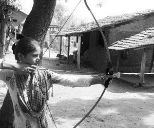Jignisha holding an archer