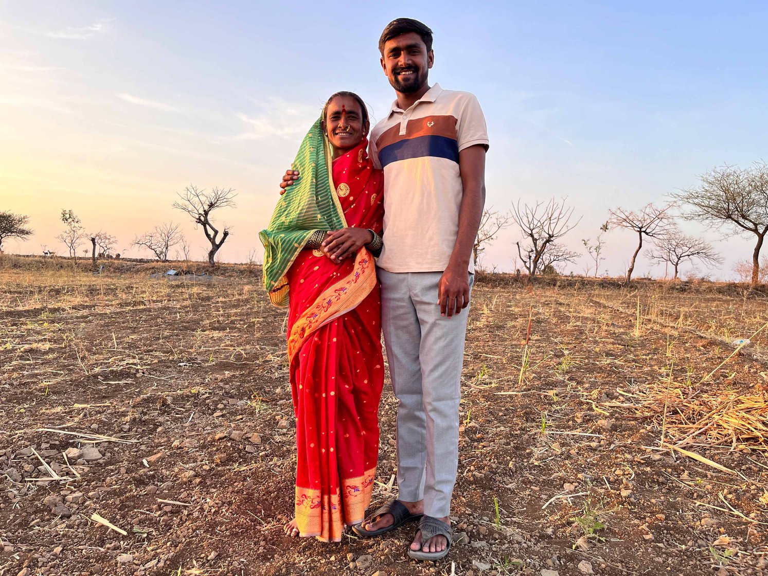 Santosh Khade and his mother, Saraswati, in the small farmland adjoining their home