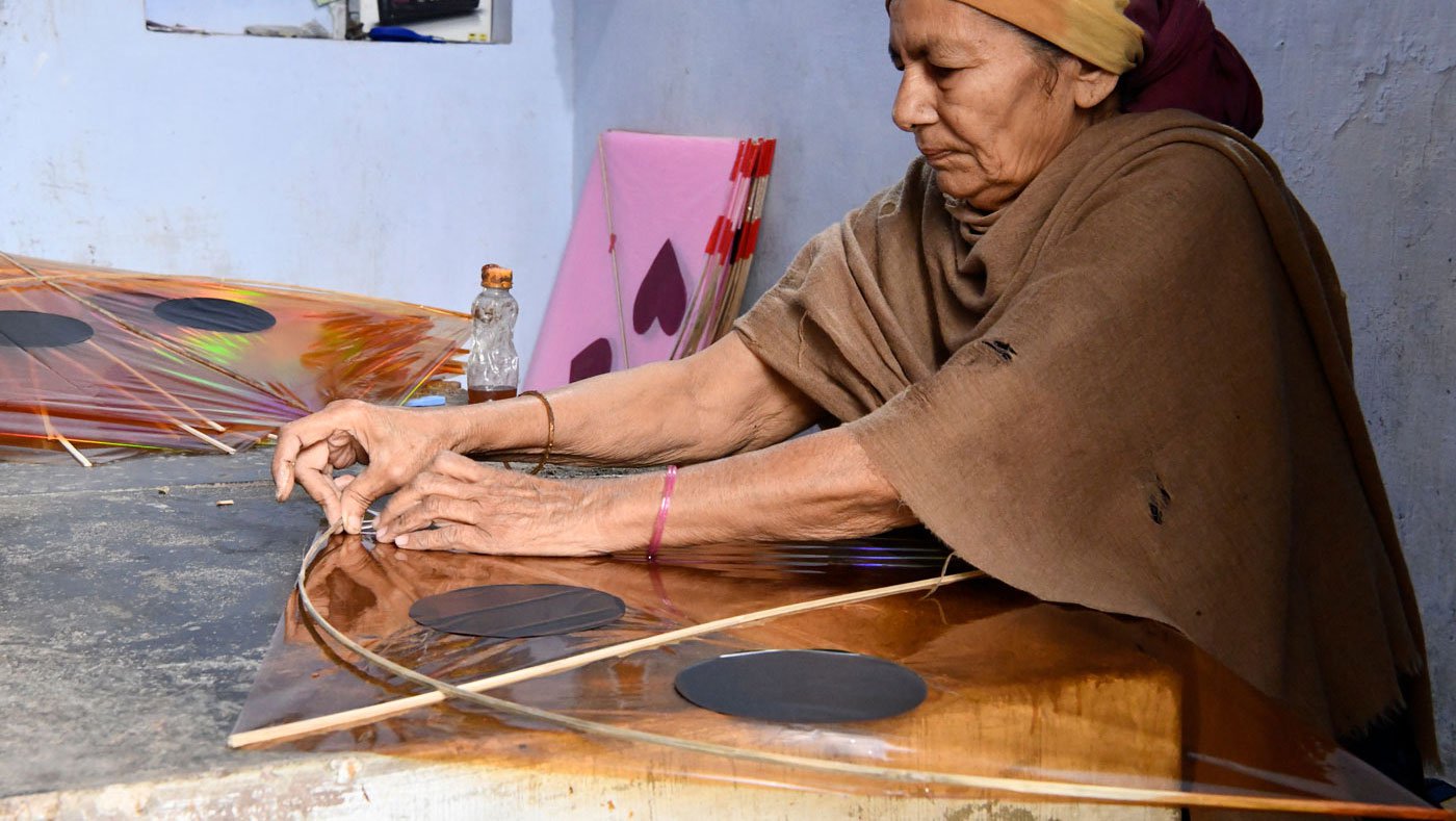 The harsh lives of the women kite makers of Khambhat and Ahmedabad stand out in stark contrast against the brilliantly coloured skies they light up with their labour