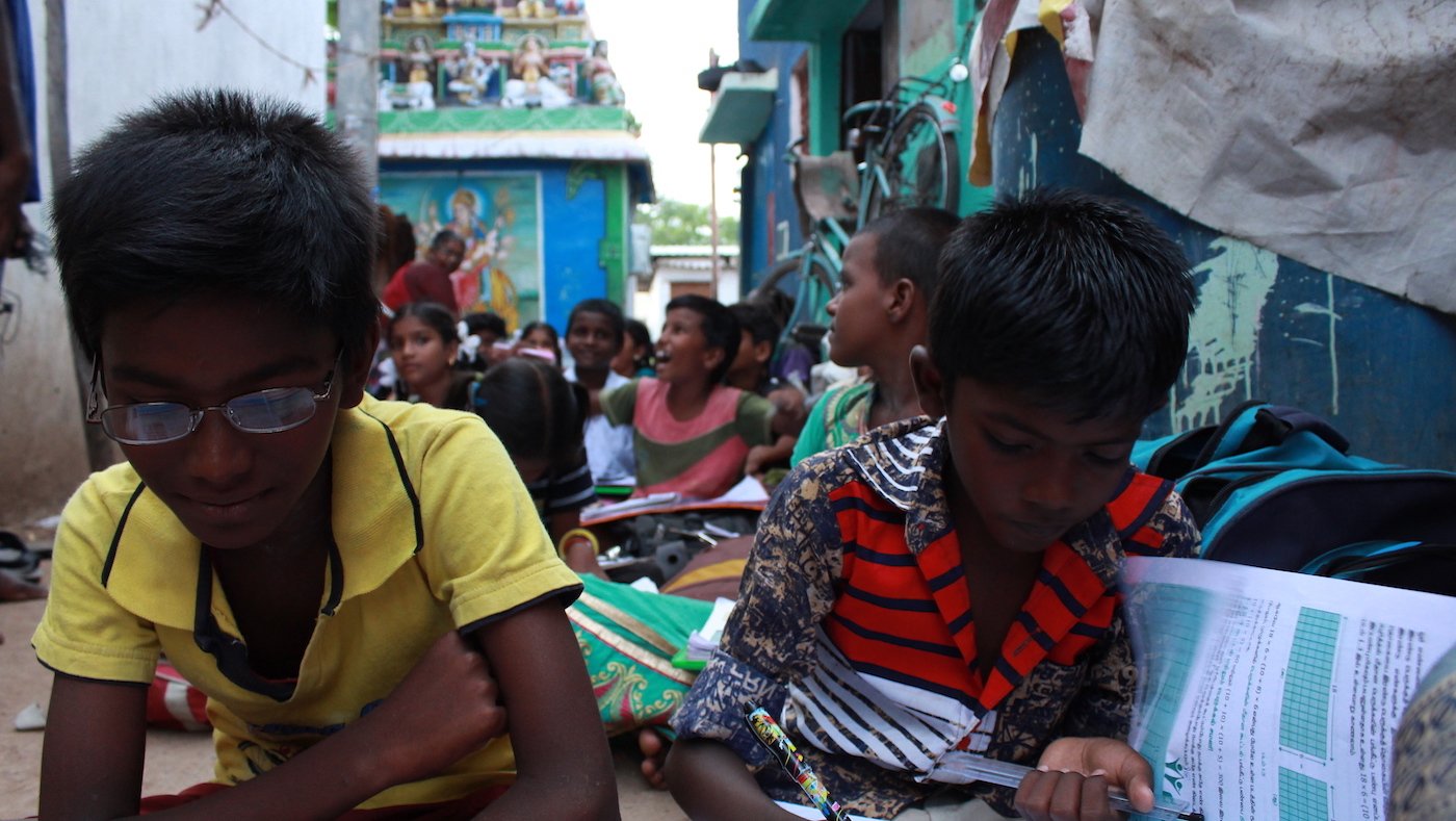 Children studying in a slum