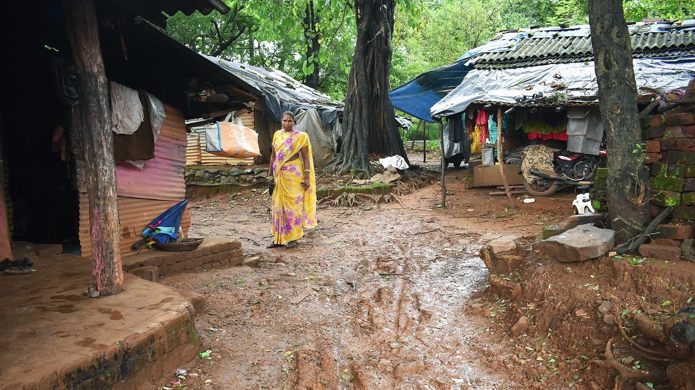 Woman standing in Adivasi hamlet