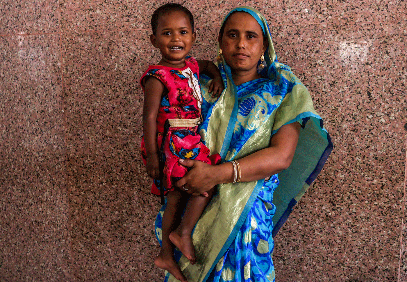 Mother and daughter standing