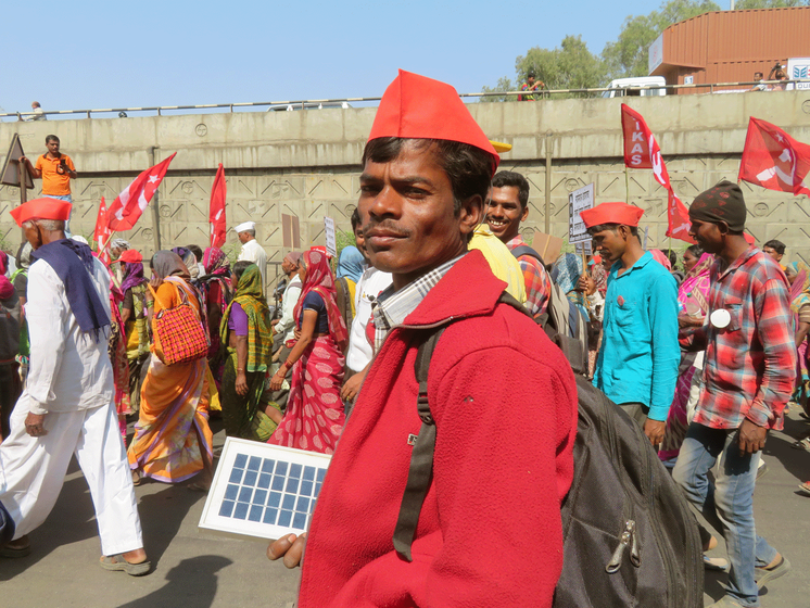 A man smiling during the march .